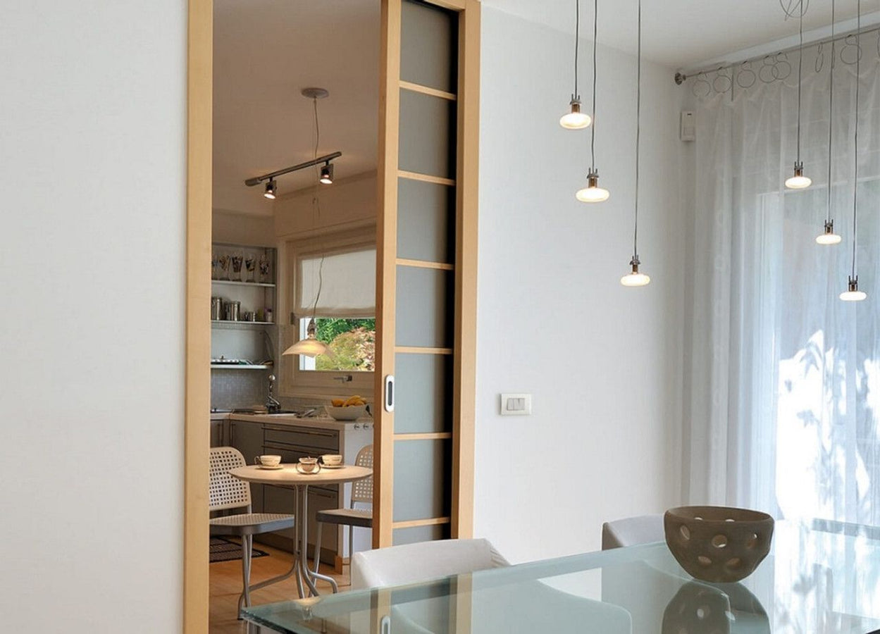 Sliding door kits; rail systems for wooden doors