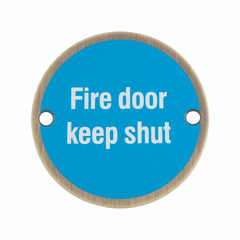 Fire Door Keep Shut Sign - 76mm Diameter - White Text - Drilled & CSK - Antique Brass With Blue Background