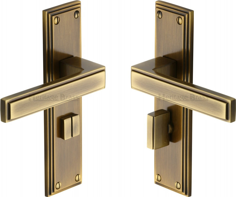 Atlantis Lever Door Handles On A Backplate - Antique Brass