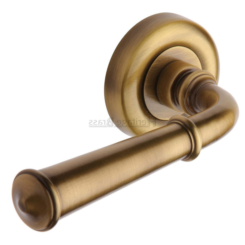 Colonial Round Rose Lever Handles - Antique Brass