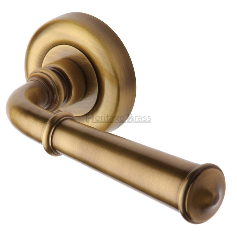 Colonial Round Rose Lever Handles - Antique Brass