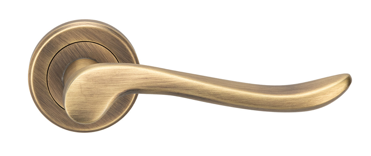Verdun Lever Handle On Concealed Fix Round Rose - Antique Brass