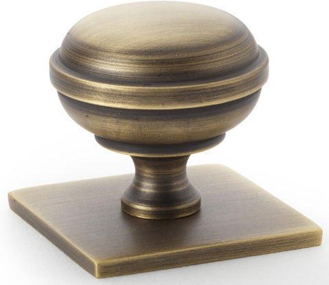 Quantock Cupboard Knob on Square Backplate - Available In Two Sizes - Antique Brass (Lacquered)