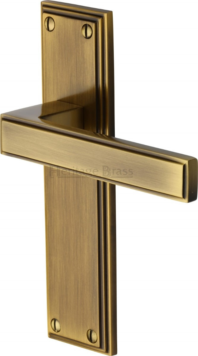 Atlantis Lever Door Handles On A Backplate - Antique Brass