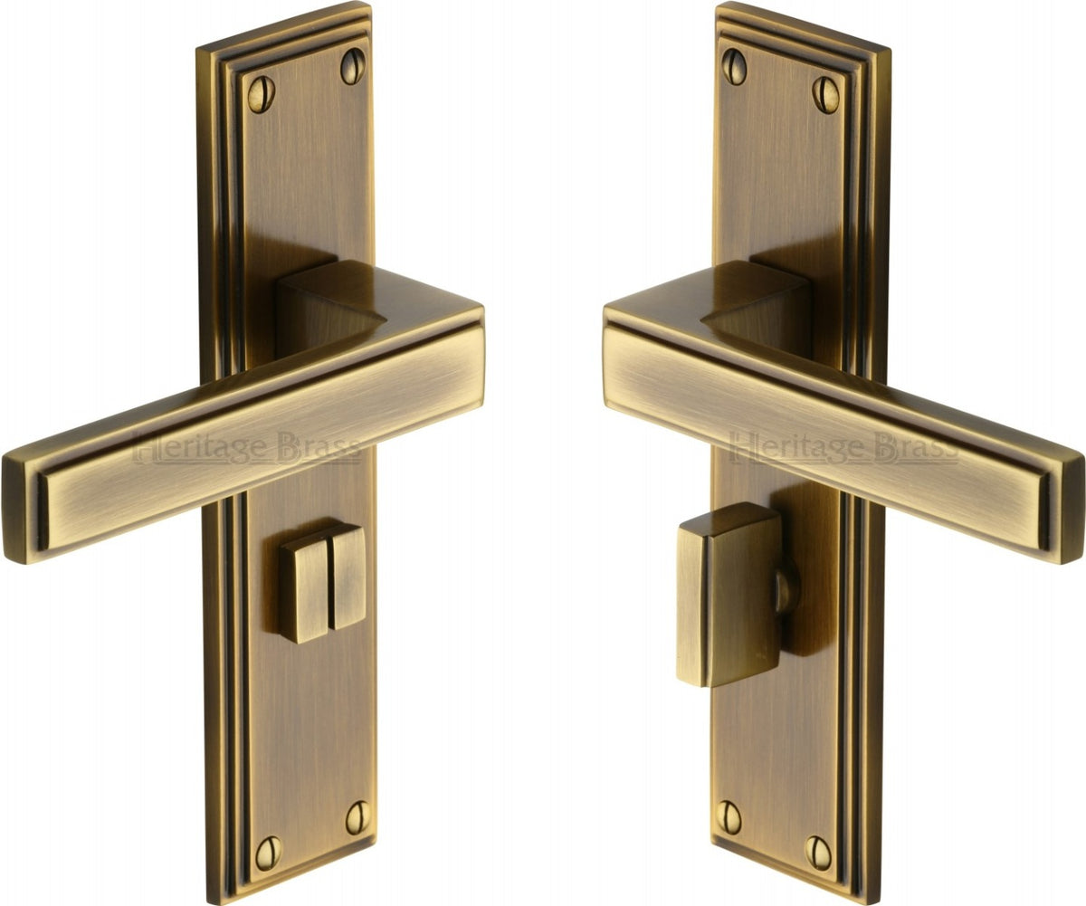 Atlantis Lever Door Handles On A Backplate - Antique Brass