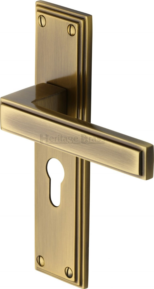 Atlantis Lever Door Handles On A Backplate - Antique Brass