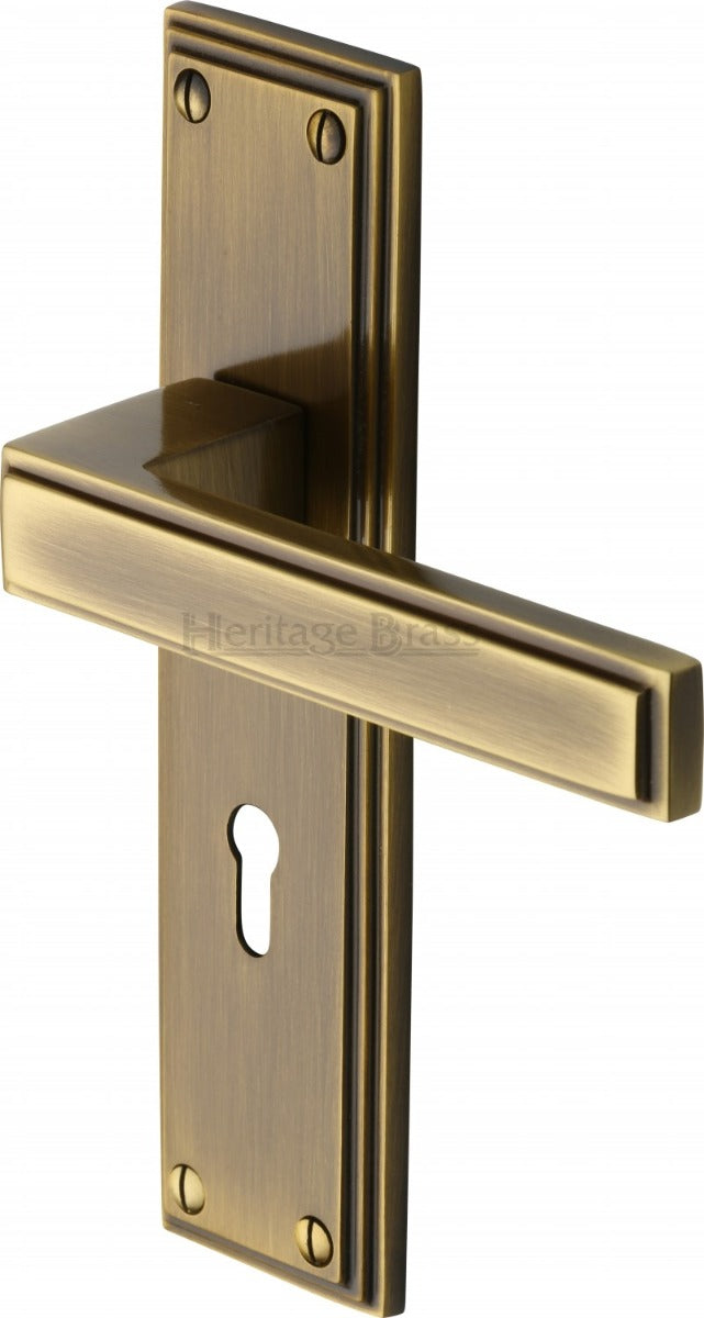 Atlantis Lever Door Handles On A Backplate - Antique Brass
