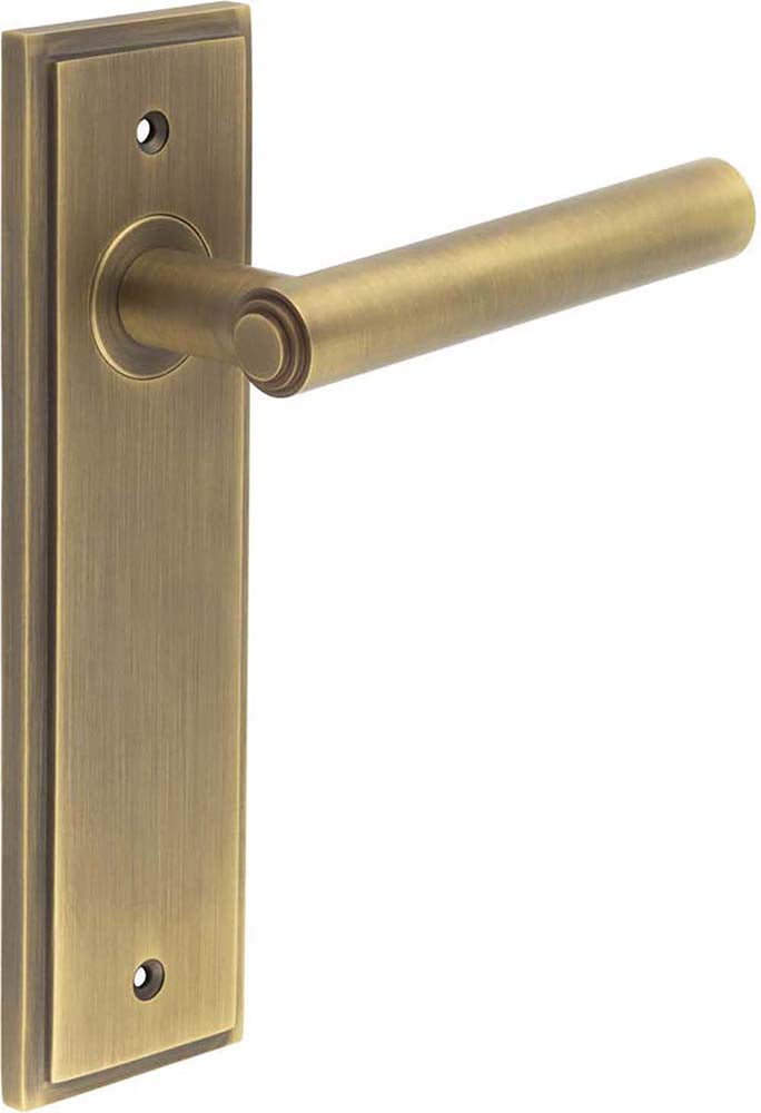 Tubular Pattern Lever Handle With Stepped Ends On A Large Rectangular Backplate - Antique Brass