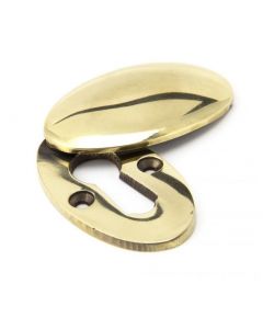 Period Standard Profile Covered Oval Escutcheon - Face Fixed - Aged Brass Unlacquered